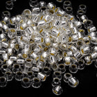 8/0 Silver Lined Crystal/Celadon Glow in the Dark Toho Seed Bead #JZP004