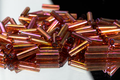 6mm Dark Topaz Rainbow Gold Luster Miyuki Smooth Bugle (8.5 Gm, 125 Gm, 250 Gm)