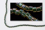 DBV273- 11/0 Olive Lined Topaz Aurora Borealis Delica Beads-General Bead